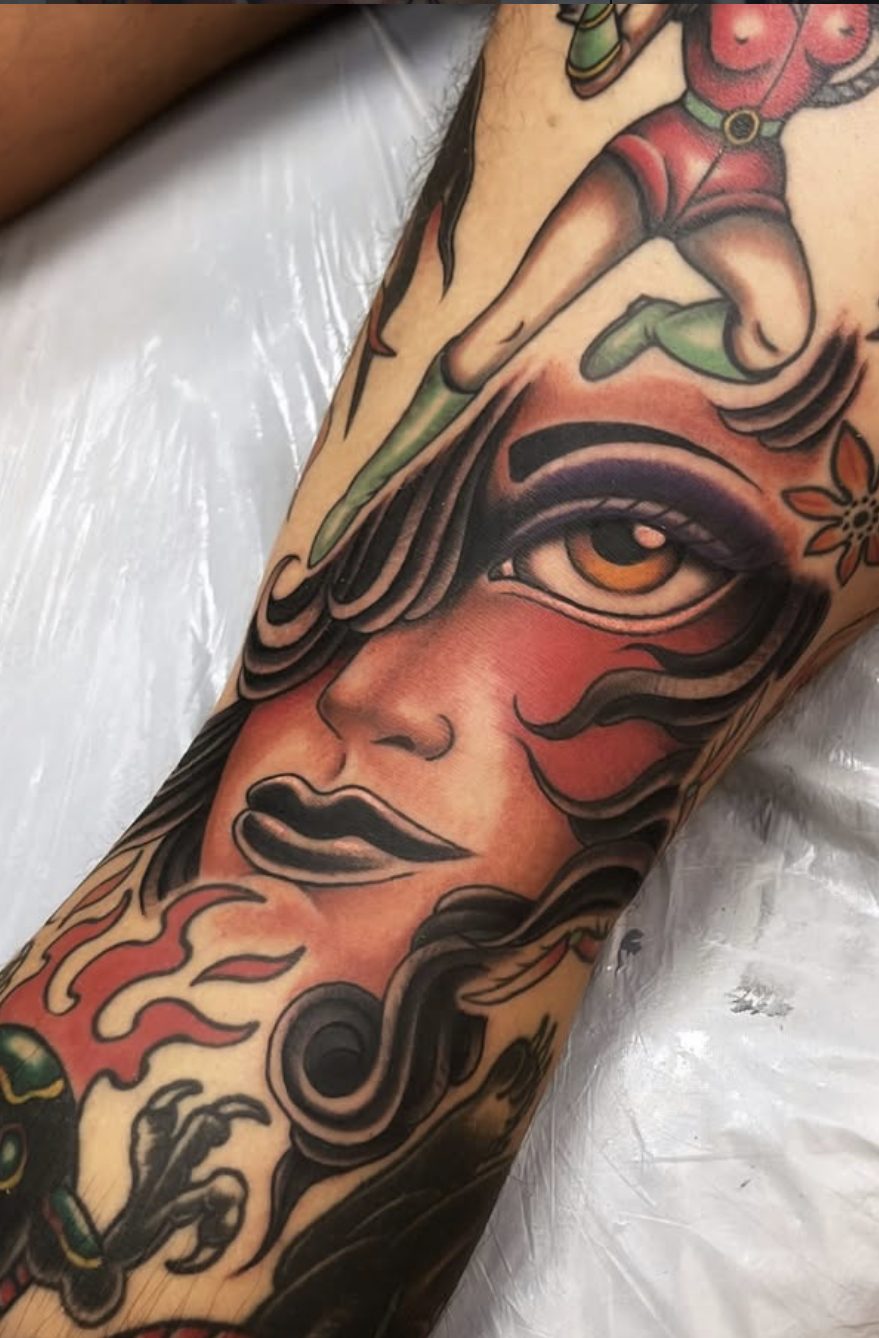 Traditional style leg sleeve with woman's face and flames by Danny Mac