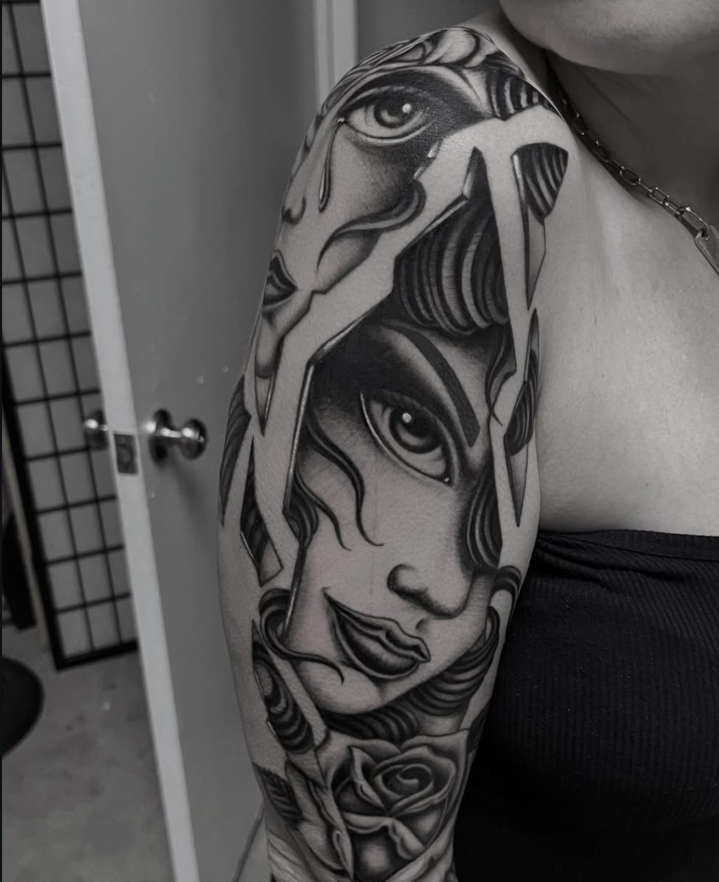 Black and gray portrait half sleeve with rose by Danny Mac