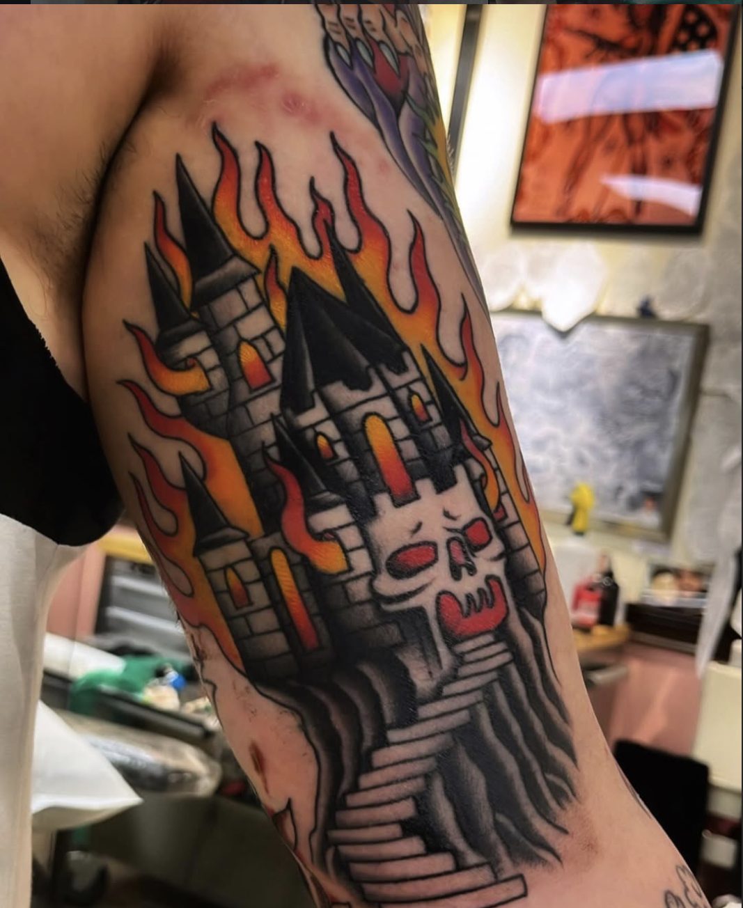 Traditional burning castle with skull arm tattoo by Danny Mac
